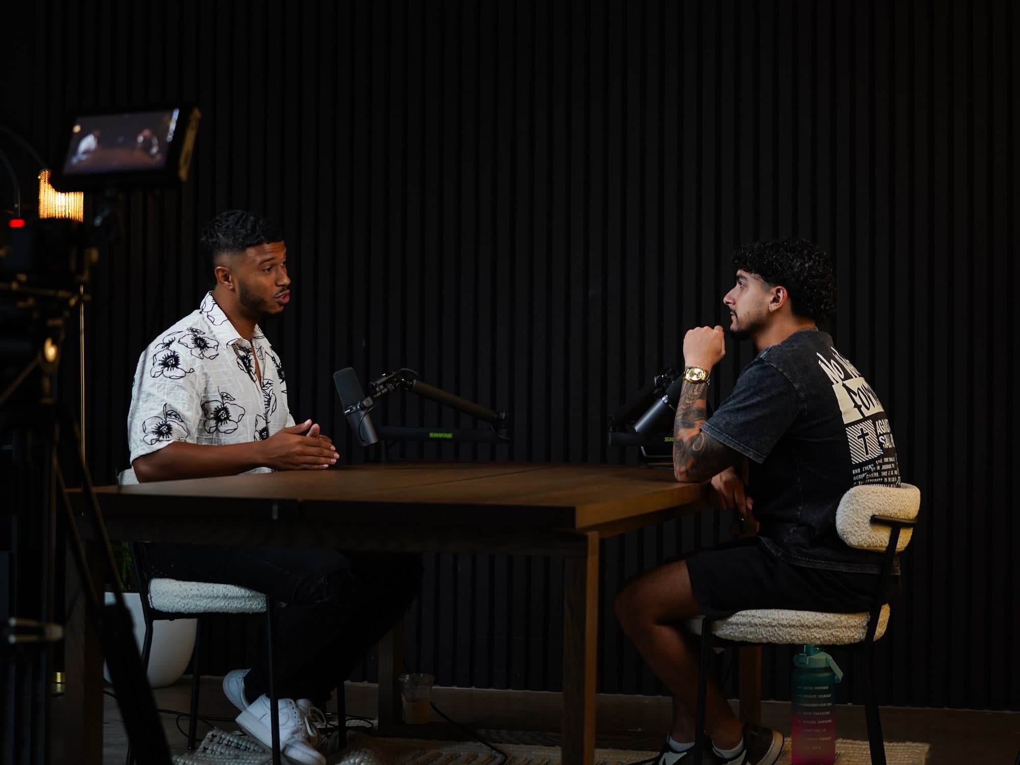 Neno in a one-on-one conversation across a table